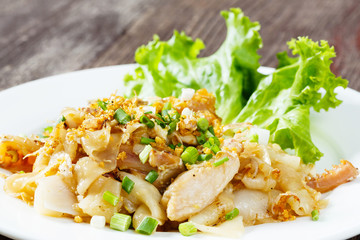 Stir fried fresh rice fat noodles with chicken and egg
