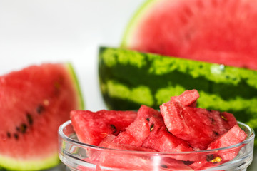 Ripe watermelon and slice isolated over white