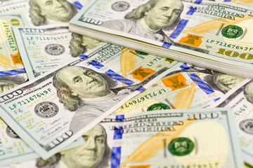 Pile of One hundred US dollar bills as wealthy concept