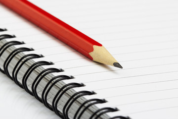 sketch book with pencil on white background