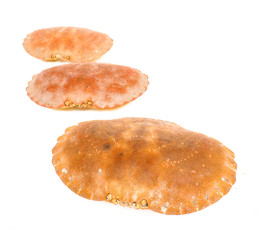 Empty orange crab shells isolated towards white background