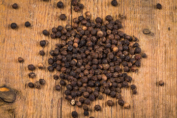black pepper on wooden table