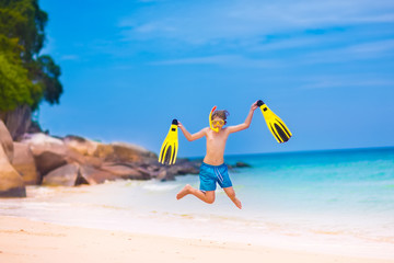 Boy jumping on a beach