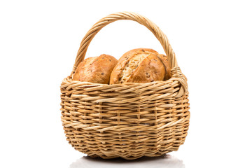 bread in wicker basket isolated on white