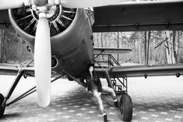 Girl posing at the plane