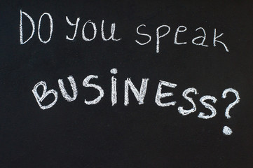 Do you speak business? message written on blackboard