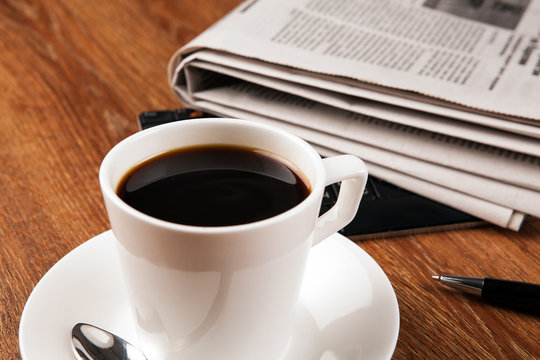 cup of coffee and the newspaper