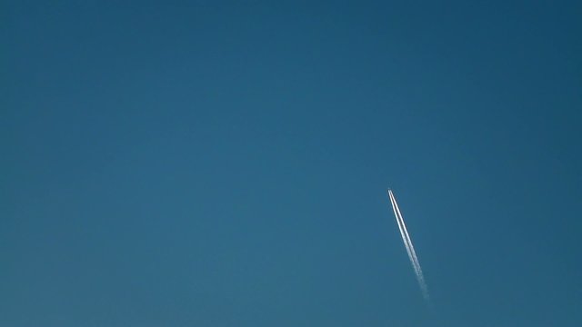 a jet plane is flying in the sky