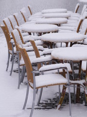 snowy chairs tables winter