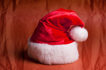 Obraz na płótnie Canvas Santa Claus red hat on red background