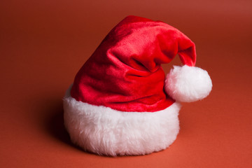 Obraz na płótnie Canvas Santa Claus red hat on red background