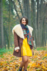 Young woman posing in autumn park