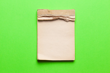 old notebook on green background