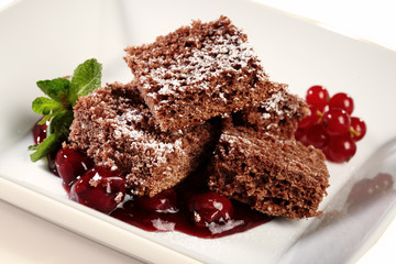 Fresh baked gingerbread with cherries and pepper mint