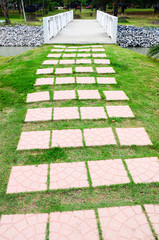 colorful cement walkway on green grass