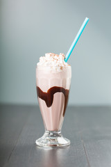 chocolate milkshake on blue background