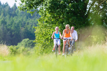 Family having weekend bicycle tour outdoors