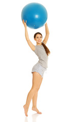Woman holding fitness ball
