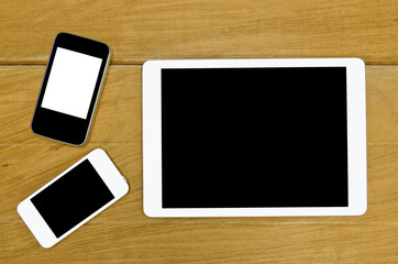 mobile tablet on wood table background , Top view