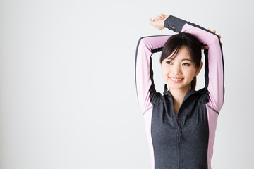 sporty asian woman on white background