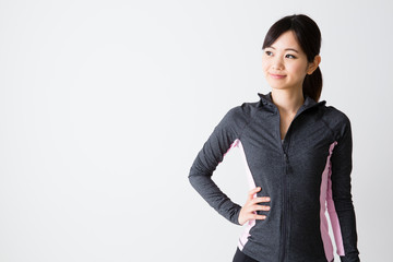 sporty asian woman on white background