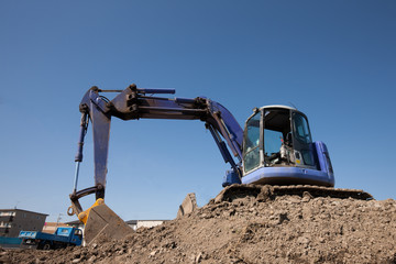 Obraz premium 工事現場のパワーショベル