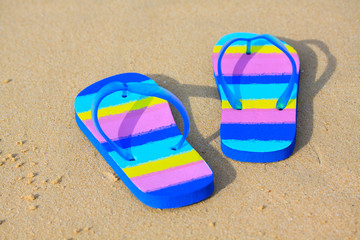 slippers on the beach