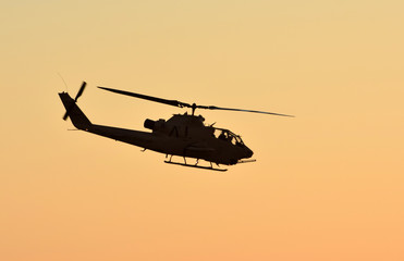 Fototapeta na wymiar Military helicopter at sunset