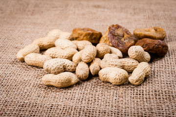 tasty peanuts and figs on burlap