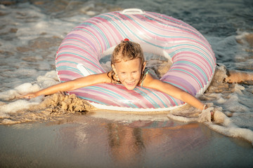 Happy little girl on the sea