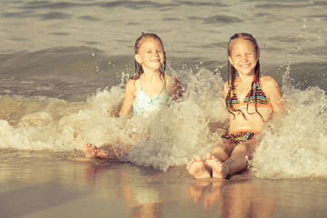 happy kids playing on beach