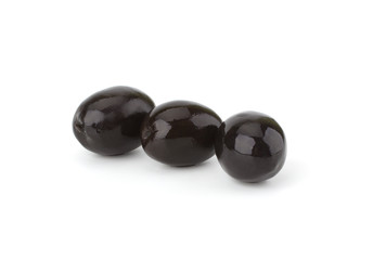 Black olives isolated on white background close-up
