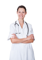 Fototapeta premium Happy Female Doctor Standing Arms Crossed