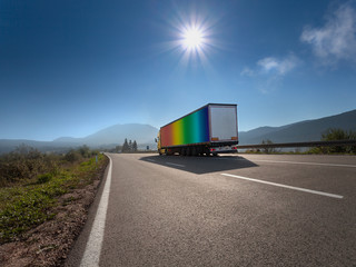 Truck in rainbow color on the highway