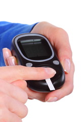 Closeup of finger with blood and glucose meter