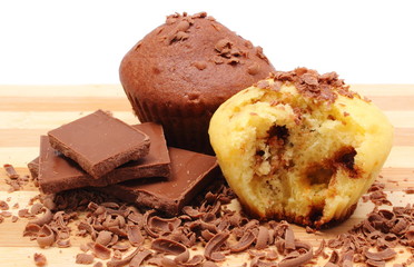 Fresh baked muffins, grated and portion of chocolate