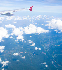 Fototapeta na wymiar Plane in the Air View from Window