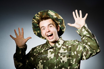 Funny soldier in military concept