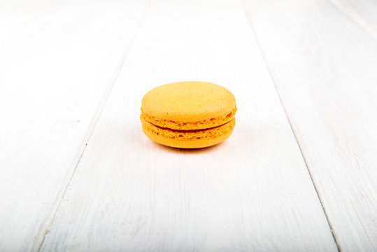 Set of macarons on white wooden table