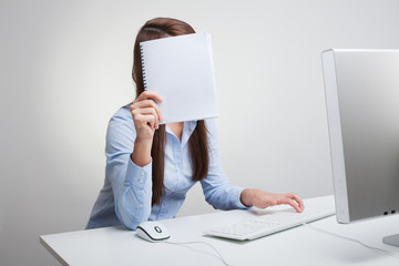Young woman Holding Blank Paper, in office