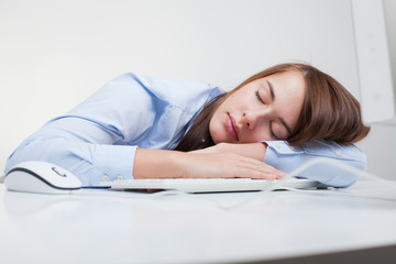 Beautiful woman tired at work