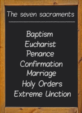 The Seven Sacraments Written On A Blackboard