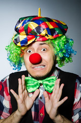 Funny clown against the dark background