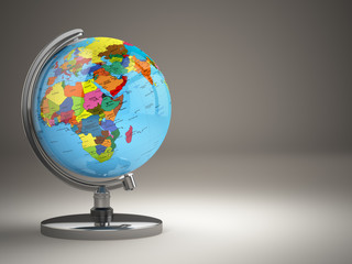 Globe with political map on grey background.