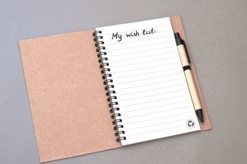 Hand drawing wish list on notebook