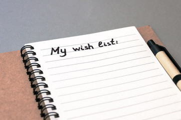 Hand drawing wish list on notebook