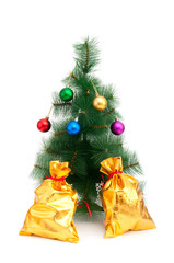 Christmas tree and golden sacks on white