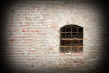 Fototapeta na wymiar window on fortress exterior wall