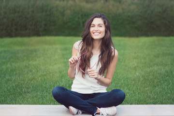 One beautiful girl seated cross legs - filtered image