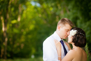 beautiful newlyweds in wedding day in the woods
